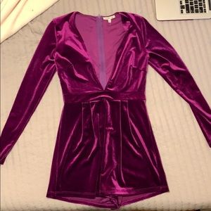 Velvet romper with plunging neck line.